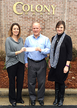 Colony Bank President Mark Turner presents donation to Foundation